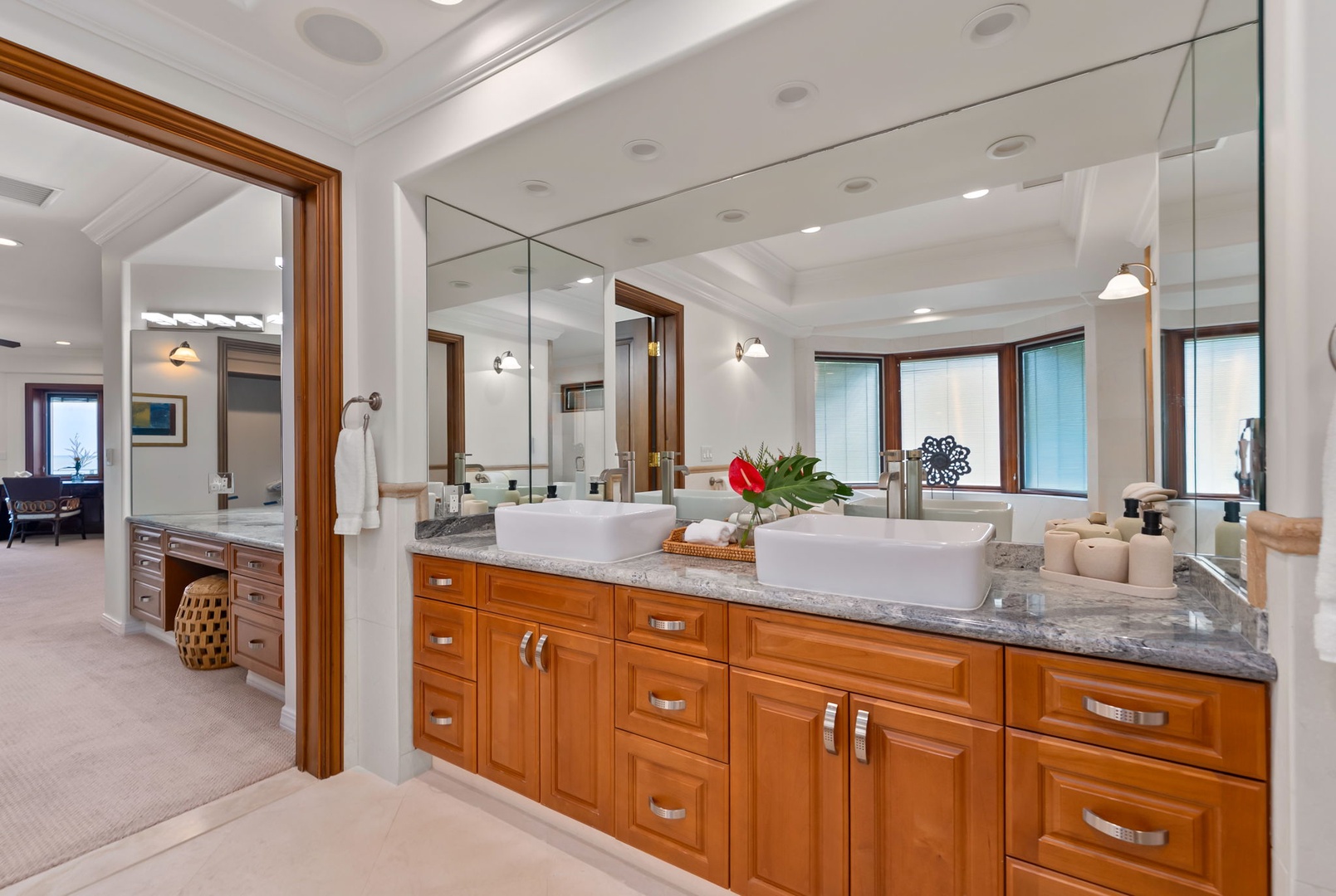 Honolulu Vacation Rentals, Maunalua Estate - Dual vessel sinks and soft natural light bring a calm, spa-like feel to your morning routine.
