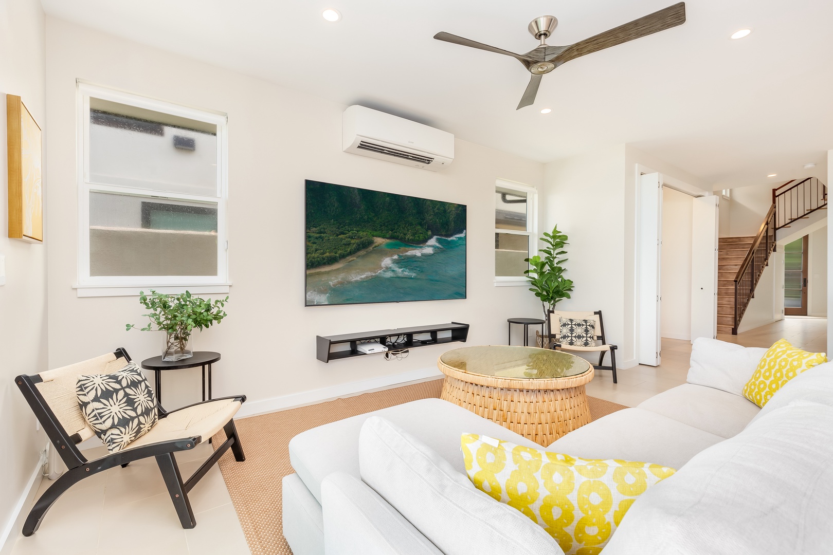 Laie Vacation Rentals, Majestic Mahakea Oceanfront Oasis - Cozy seating arrangement in the living room, designed for relaxing and enjoying the scenery.