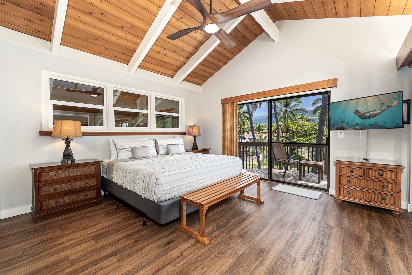 Kailua Kona Vacation Rentals, Kanaloa at Kona 1606 - The primary suite rises under vaulted wood beams, its own lanai just off the room.