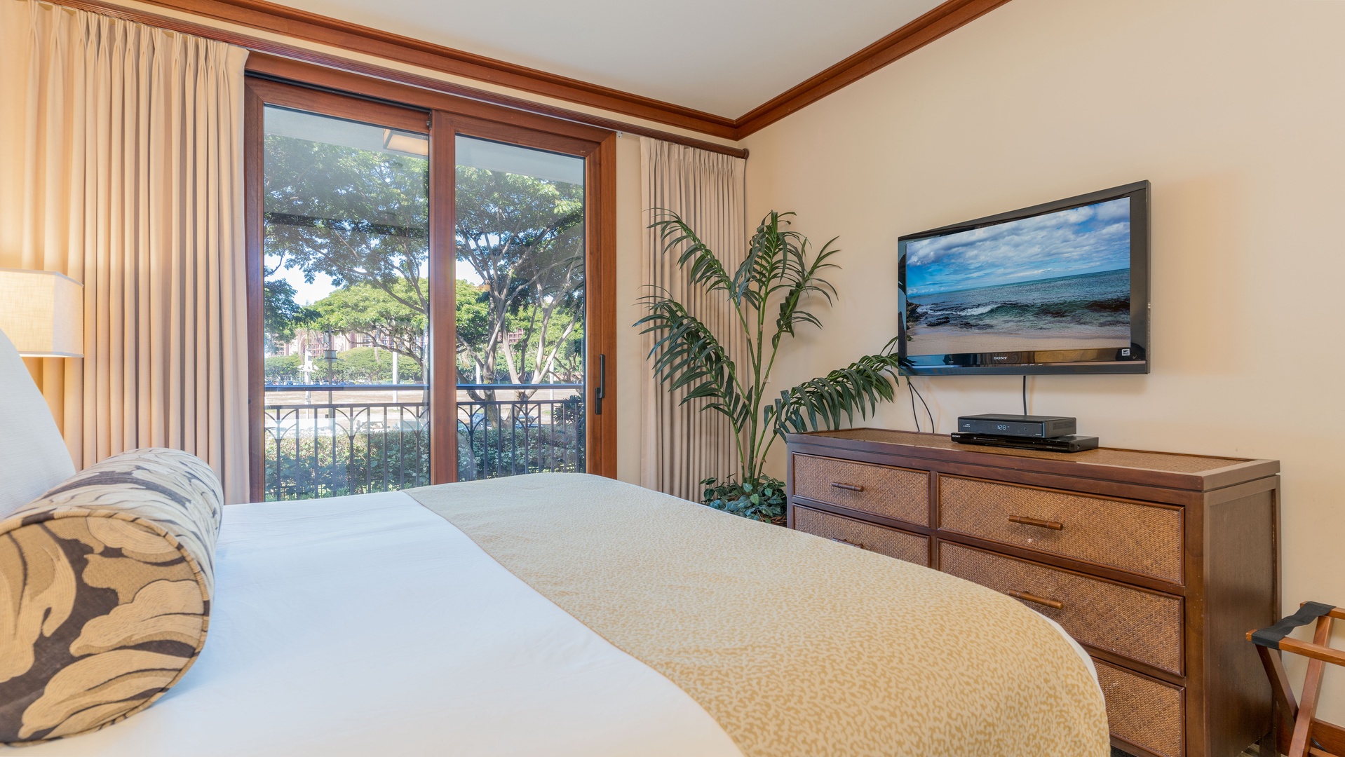 Kapolei Vacation Rentals, Ko Olina Beach Villas B202 - The primary guest bedroom dresser and TV.