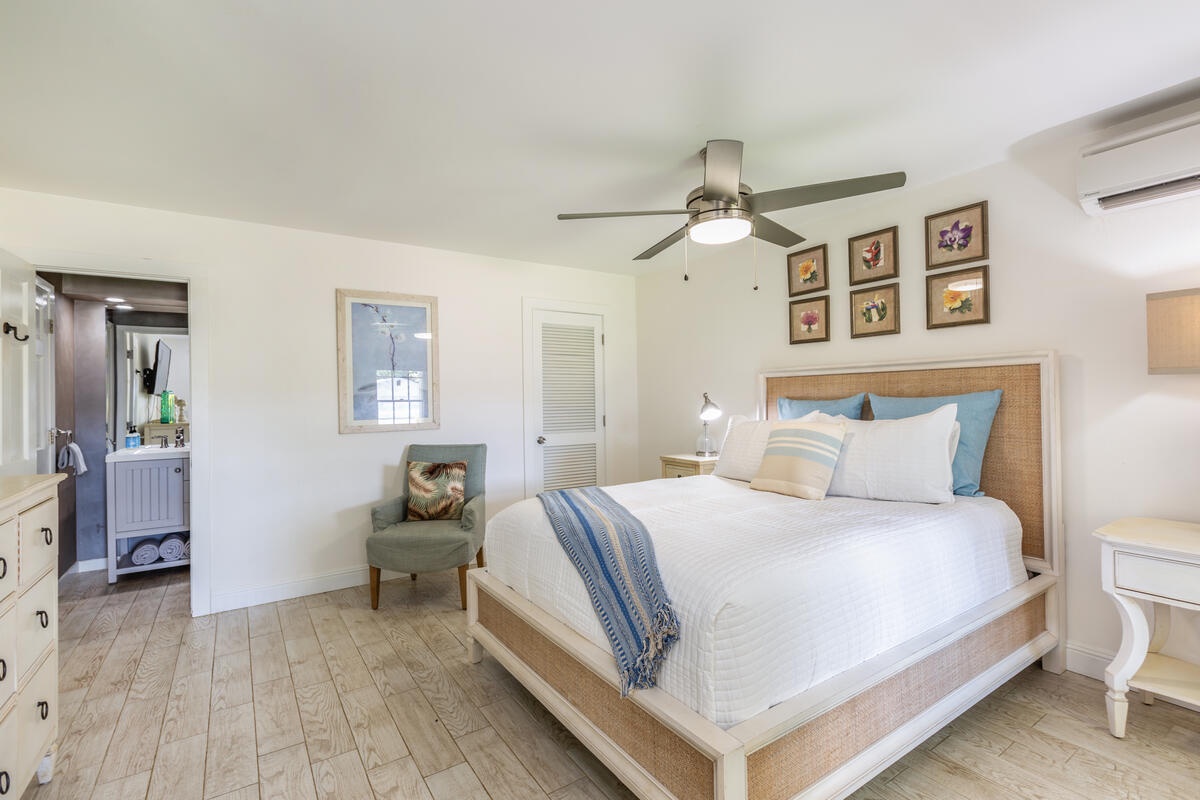 Princeville Vacation Rentals, Hokulani Villa - Bright and airy bedroom featuring a queen-sized bed, ideal for a restful night's sleep.