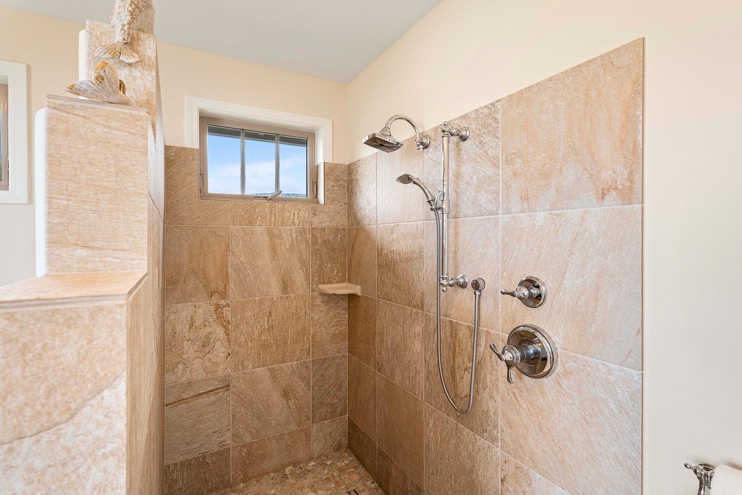 Kailua-Kona Vacation Rentals, Holua Kai #26 - The second bathroom has simplistic and functional tiled shower space with modern fixtures.
