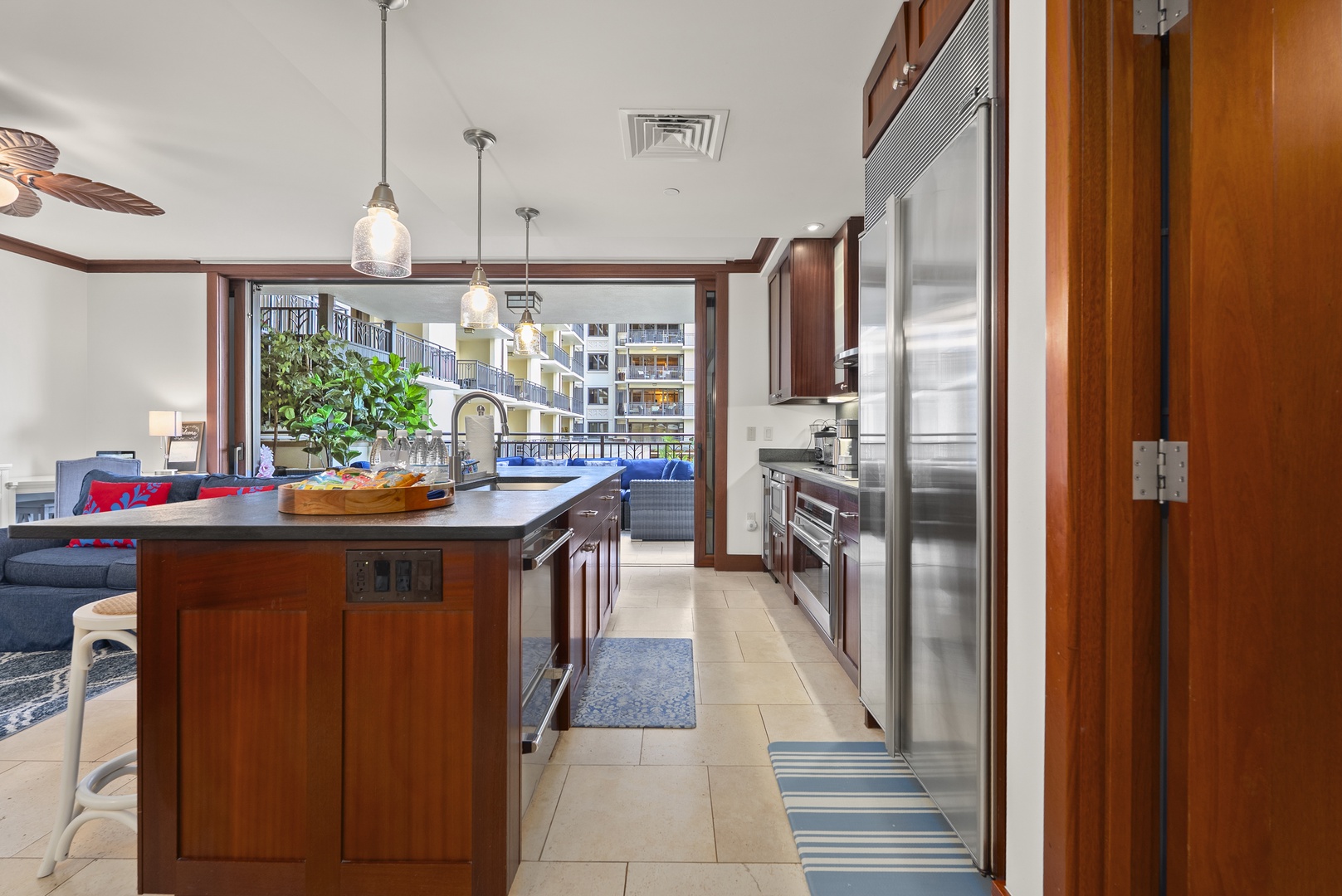 An island wide enough that two cooks never bump elbows, prep space to spare.
