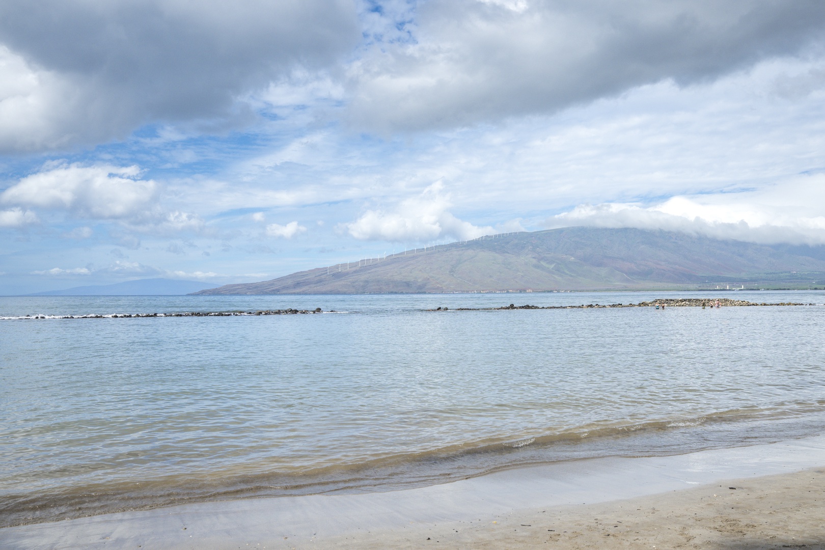 Kihei Vacation Rentals, Kihei Bay Surf B212 - Gentle waves and dramatic mountain backdrop creates a stunning coastal setting.