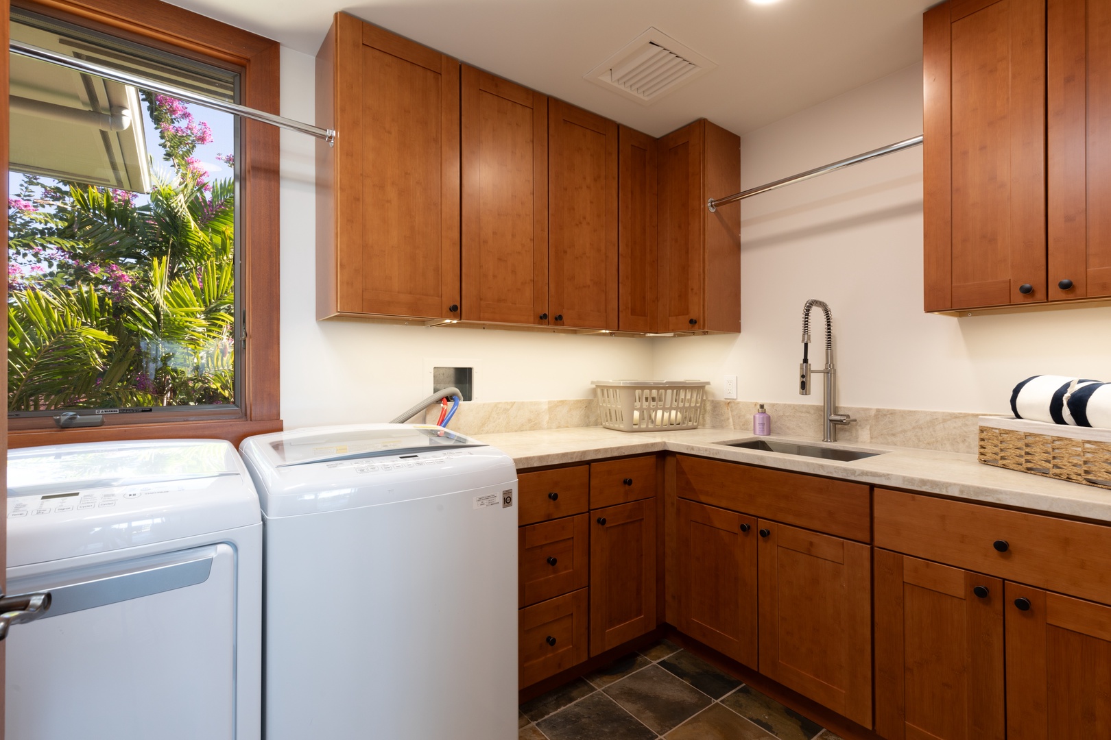Kailua Kona Vacation Rentals, 3BD Waiulu Villa (111D) at Hualalai Resort - Laundry room equipped with modern appliances for guest convenience.