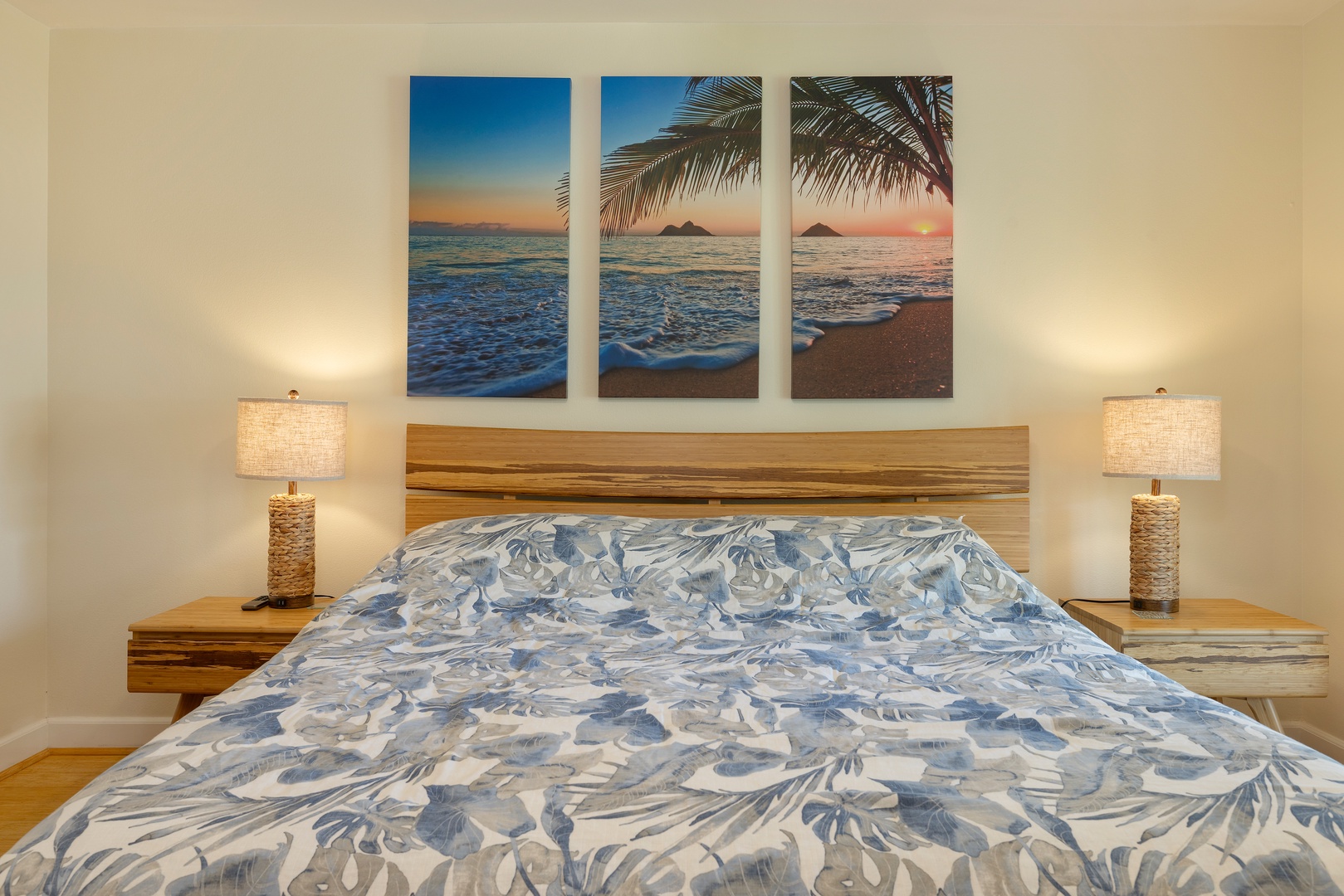 Kapolei Vacation Rentals, Ko Olina Kai 1083C - The spacious guest bedroom with soft blue patterns and a large mirror.