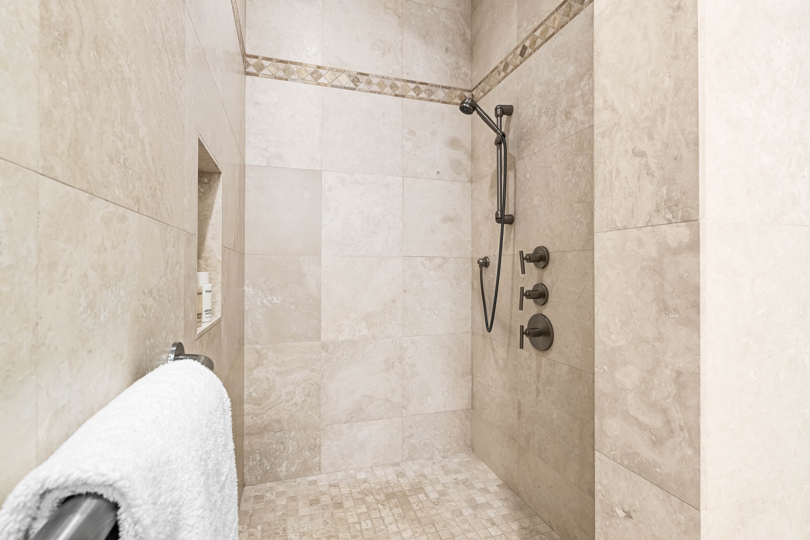 Honolulu Vacation Rentals, Pili Pono - Spa-style walk-in shower with rain head and neutral tile.