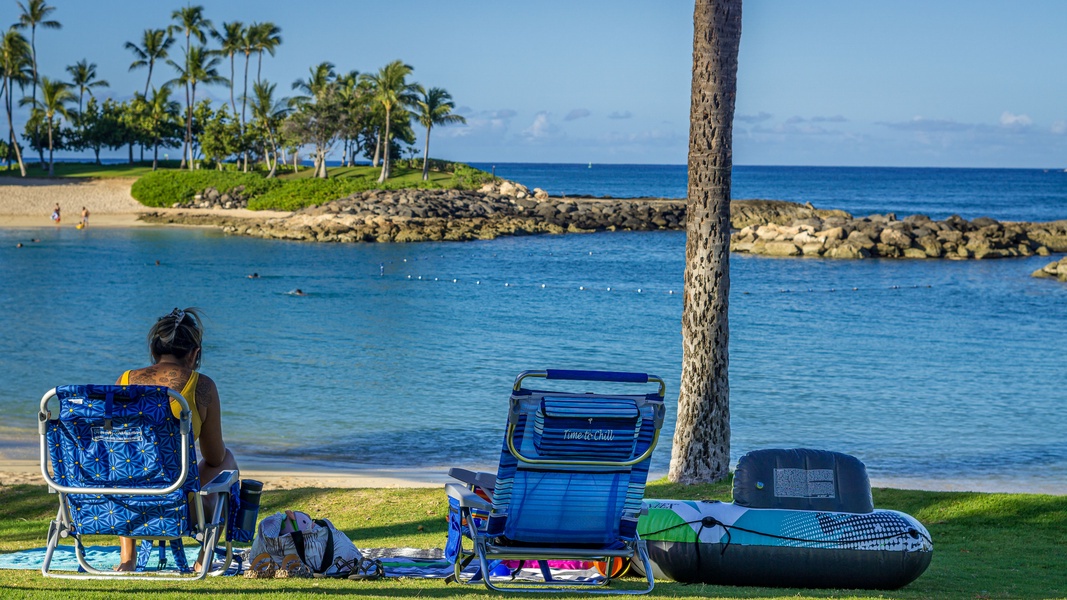 Kapolei Vacation Rentals, Coconut Plantation 1150-2 - Relax under a swaying palm tree near the sandy shoreline overlooking the crystal clear lagoon.