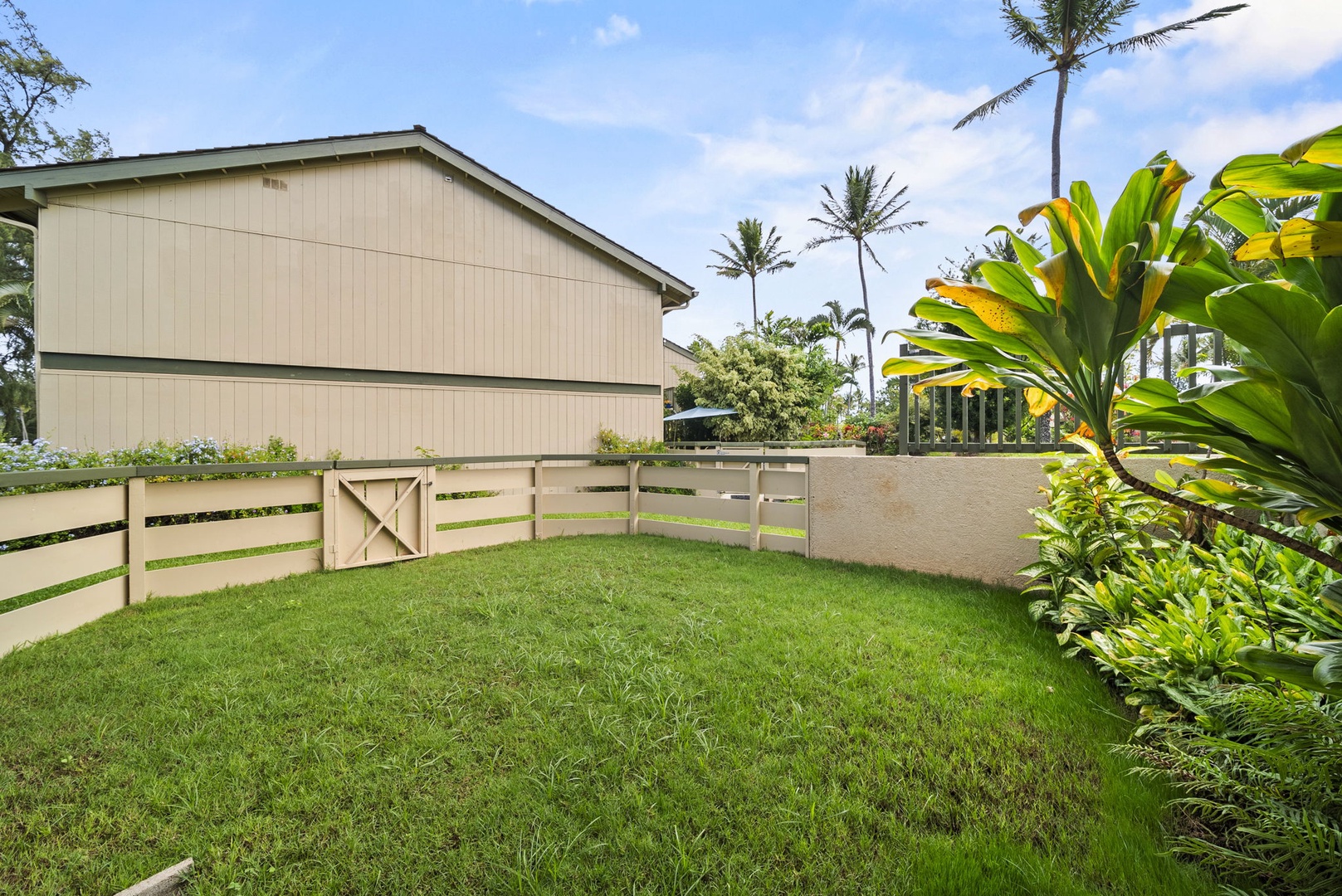 Kahuku Vacation Rentals, Kuilima Estates West #85 - Private, fenced in yard just outside the kitchen doors.
