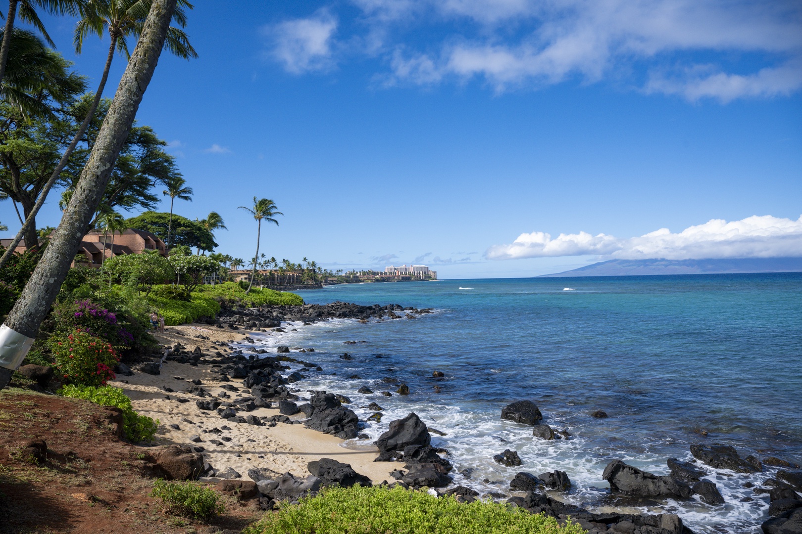 Lahaina Vacation Rentals, Polynesian Shores 114 - The lava-rock shoreline and tide pools start just past the lawn, yours to explore.