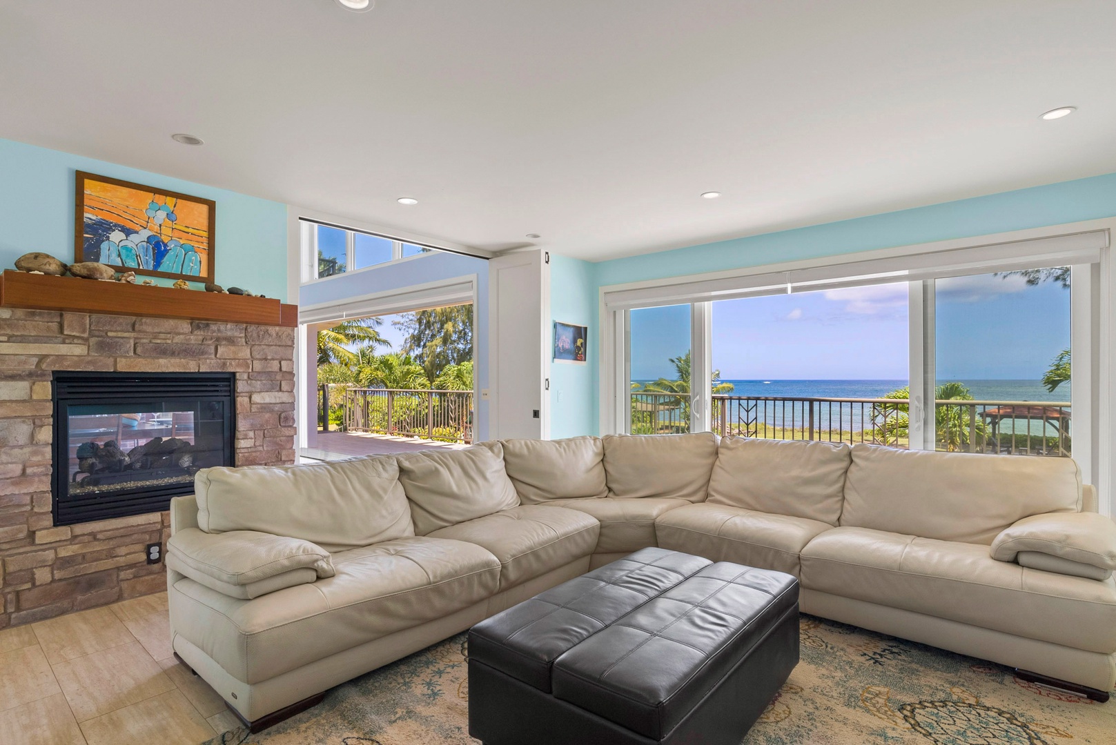 Waialua Vacation Rentals, Waialua Beachfront Getaway - L-shaped couches with fireplace, a tv and Ocean views