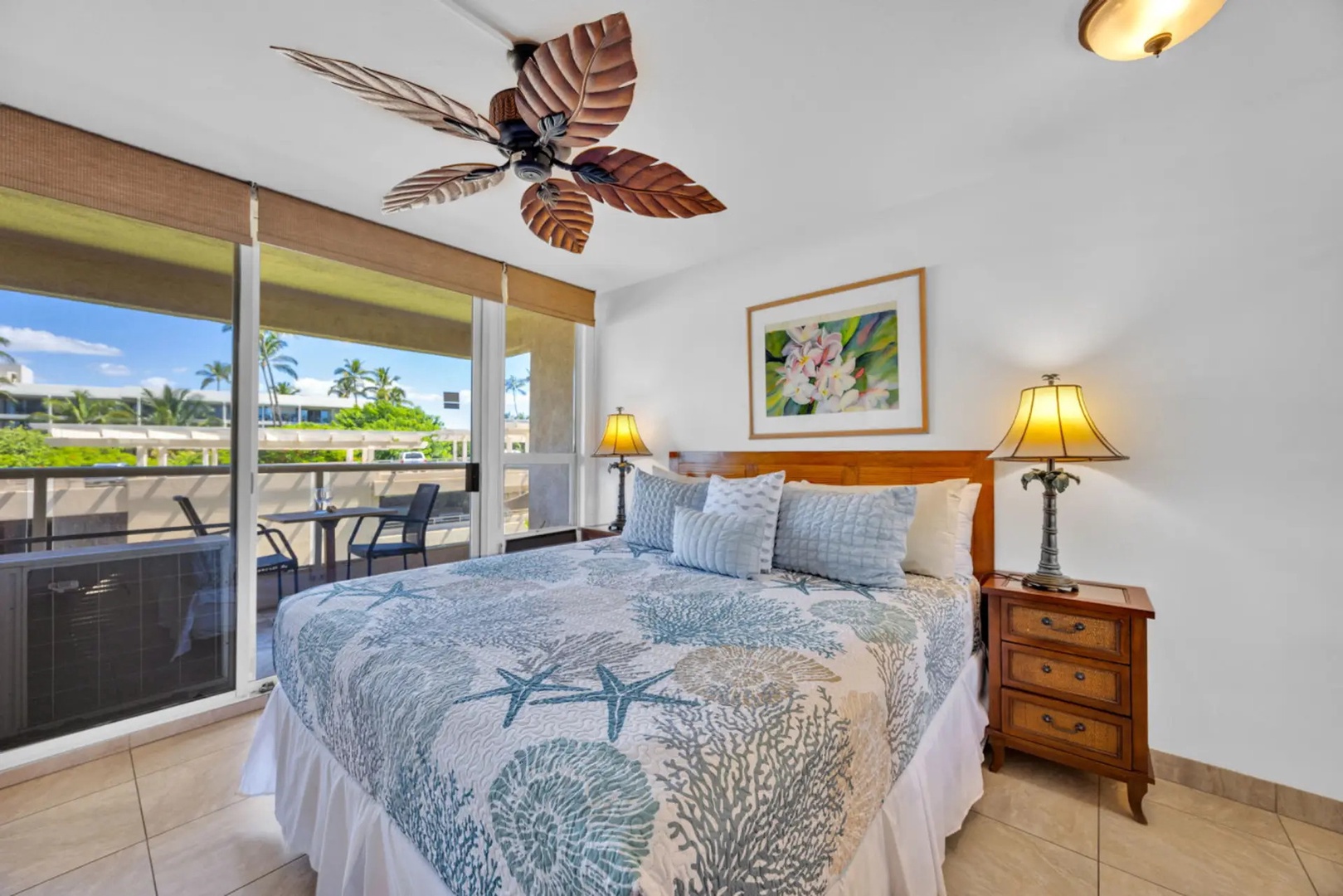 Kihei Vacation Rentals, Maui Banyan H306 - The bedroom opens to the lanai, so the palms are the first thing you see each morning.