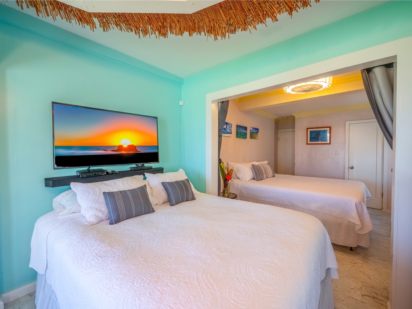 Hauula Vacation Rentals, Private Beach Paradise - Drift off to sleep in your tropical bedroom where turquoise walls and natural textures create pure serenity.