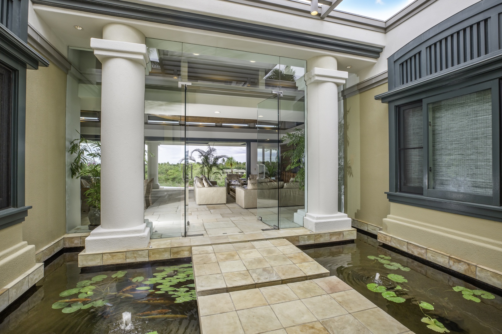 Kamuela Vacation Rentals, Canoe House at Champion Ridge - Elegant columns and floating stone pathways welcome you with resort-style sophistication and tropical charm.