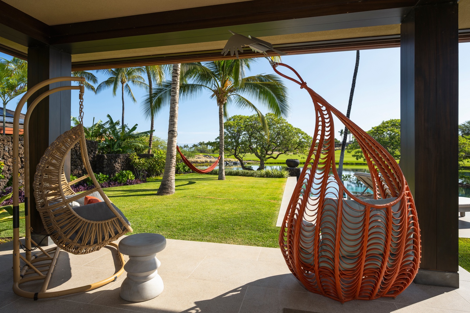 Kailua-Kona Vacation Rentals, 4BD Ka'Ulu Estate (102A) at Hualalai Resort - Primary Suite #1: Relax in stylish seating overlooking lush island landscaping.