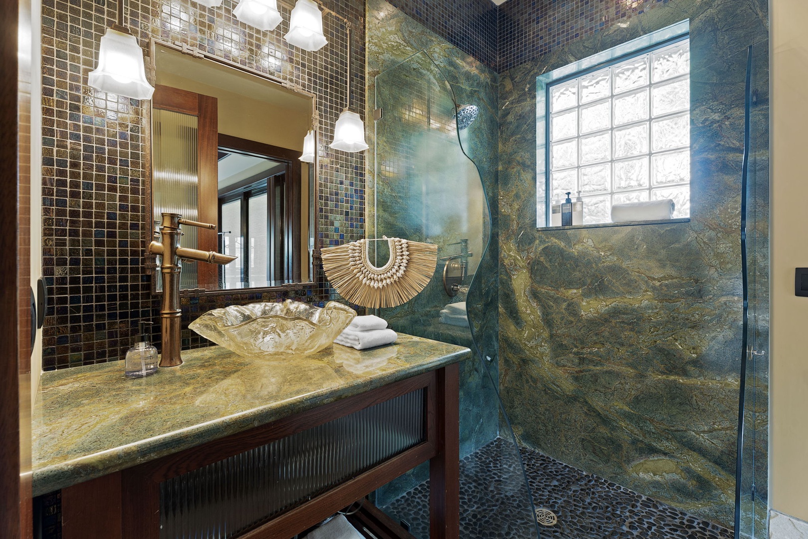 Kamuela Vacation Rentals, Hale Konane - Luxe ensuite bathroom with sleek stone finishes, walk-in shower, and custom vanity for a spa-quality experience.
