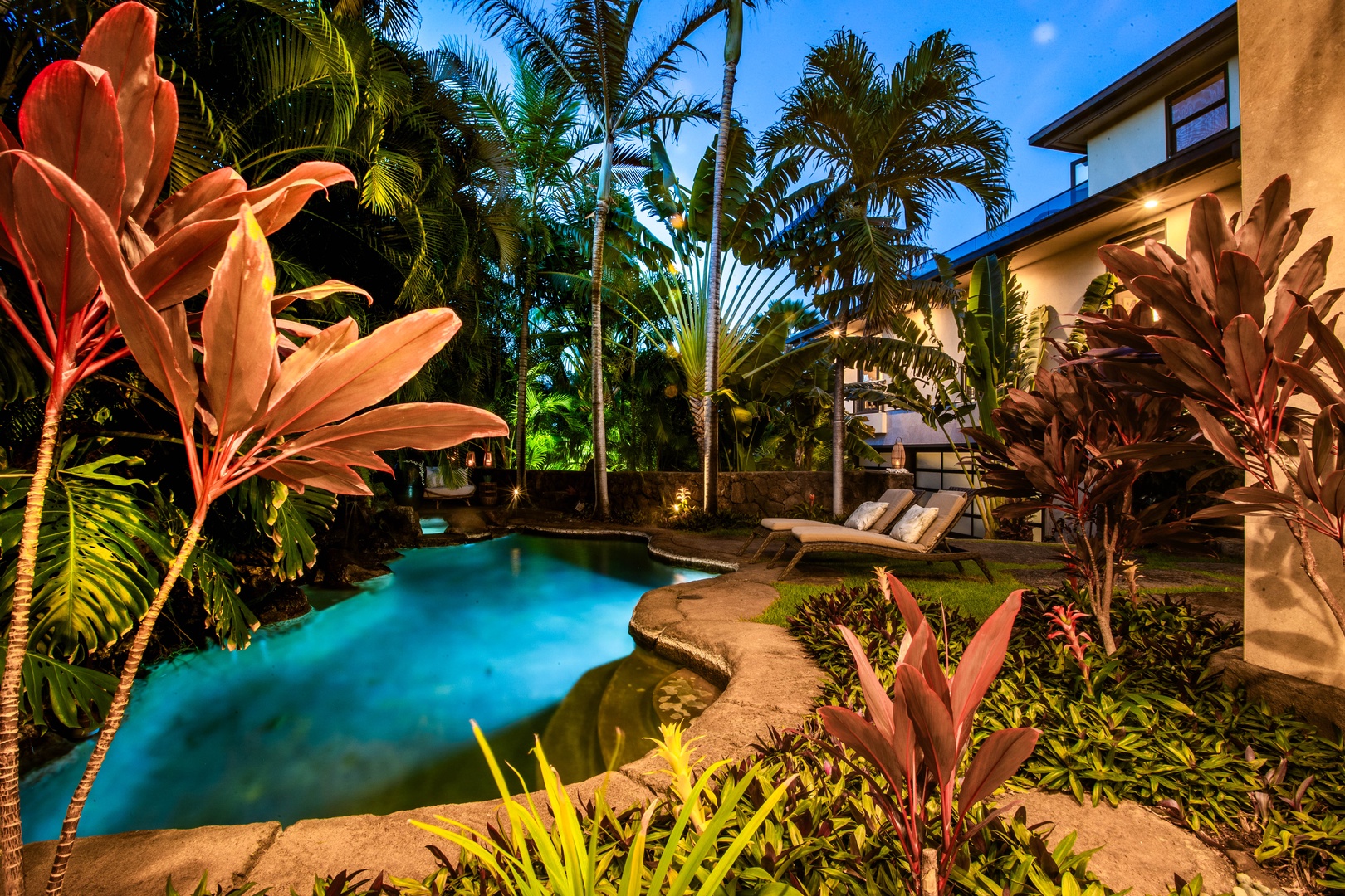 Honolulu Vacation Rentals, Pili Pono - Spa and seating tucked into a vibrant tropical oasis.