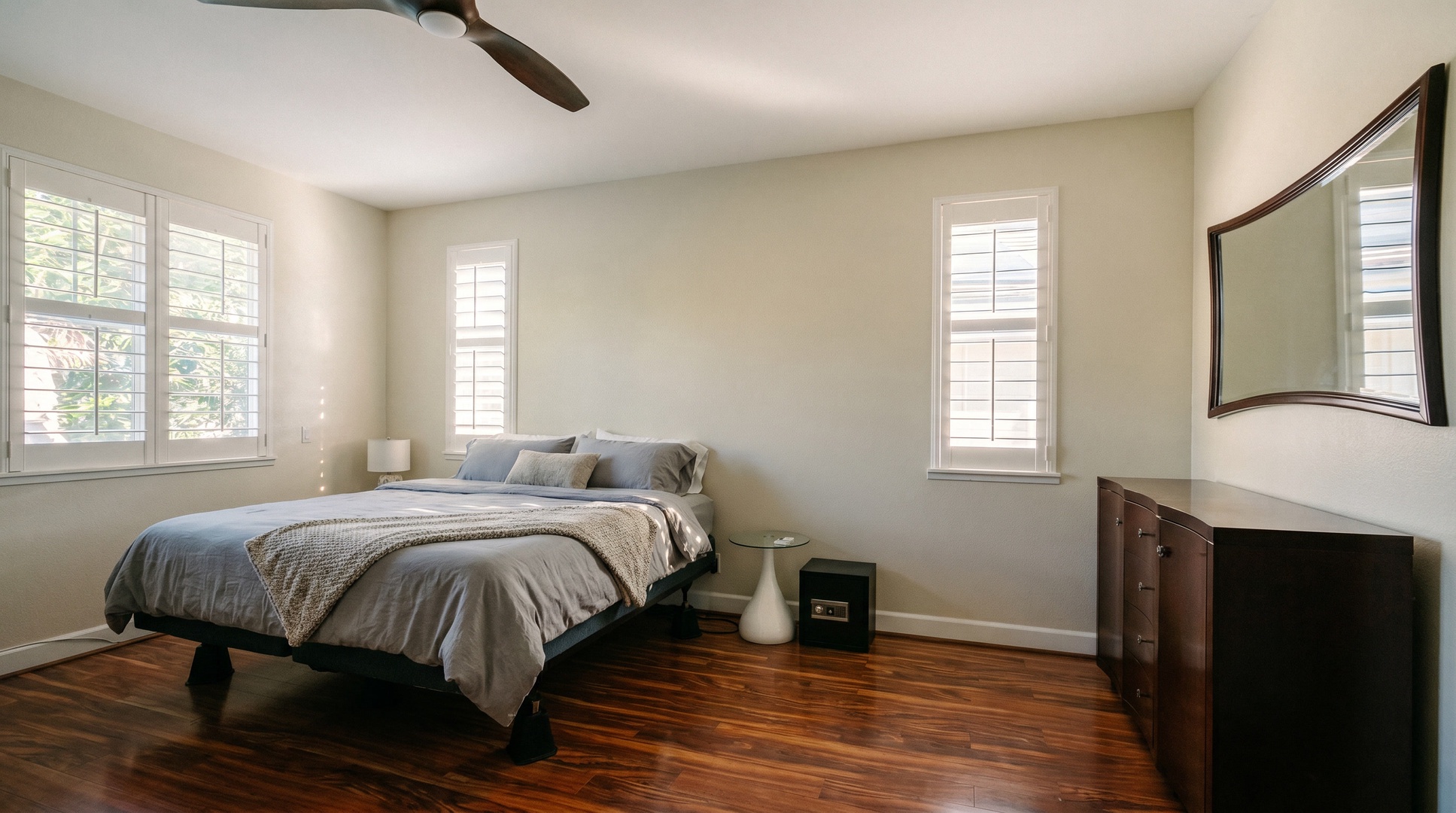 Wake slowly in the King primary bedroom, a ceiling fan turning overhead and the shutters drawn.