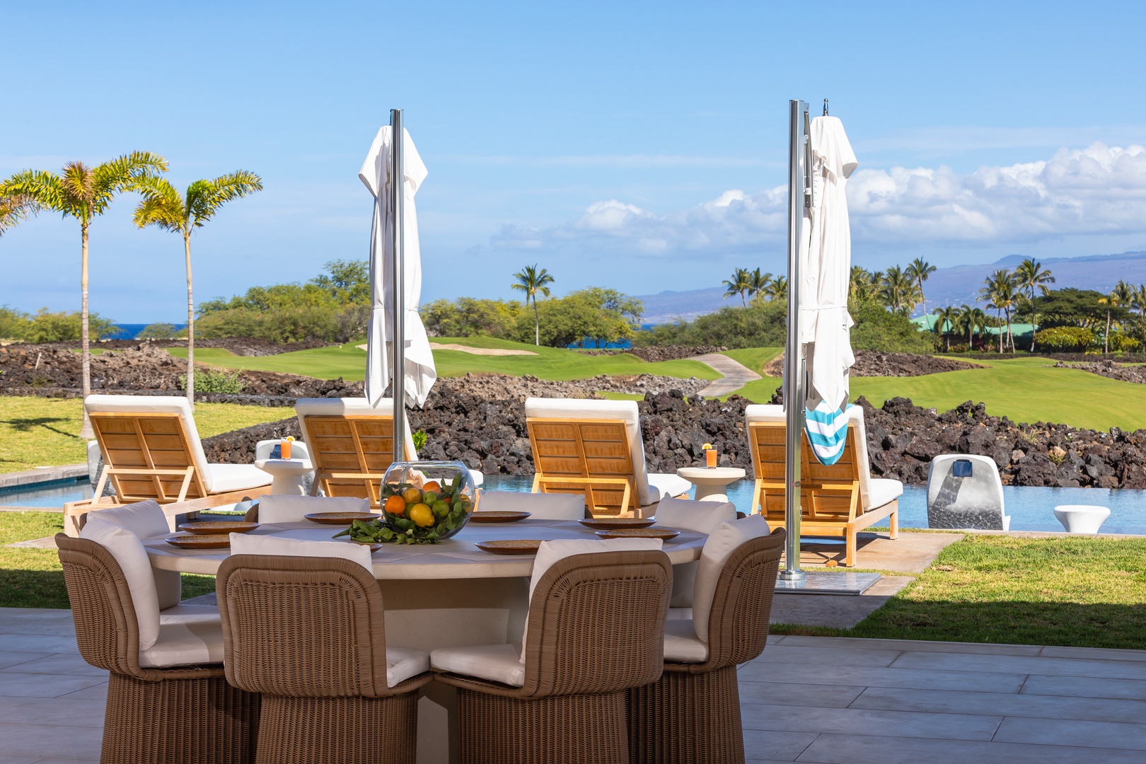 Kamuela Vacation Rentals, 5BD Mauna Lani Lux Ocean Estate (OE12) at One Ocean - Dine alfresco at your elegant outdoor table overlooking the golf course and ocean, where tropical breezes enhance every meal.