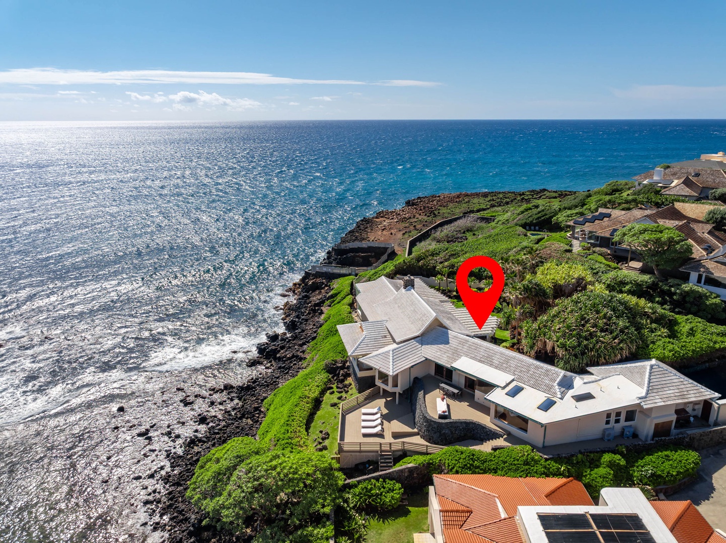 Honolulu Vacation Rentals, Black Point Ocean Villa - Stunning oceanfront property positioned directly on dramatic volcanic coastline with expansive Pacific views and lush tropical landscaping.