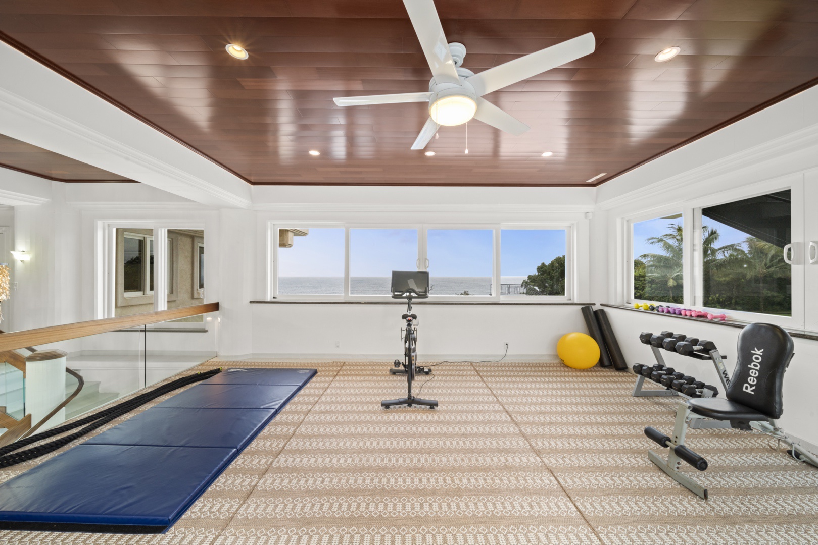 Ninole Vacation Rentals, Waterfalling Estate - Ocean view fitness room w/Peloton bike, weight bench and more!