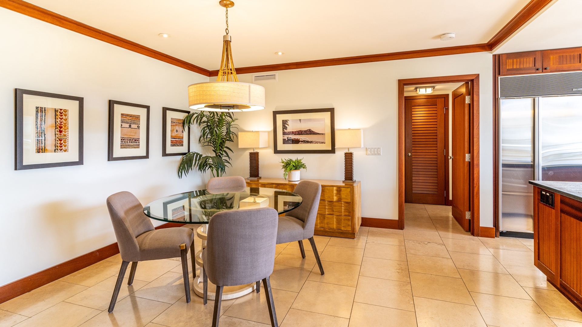Kapolei Vacation Rentals, Ko Olina Beach Villas B403 - The spacious dining are with boutique lighting and framed art.