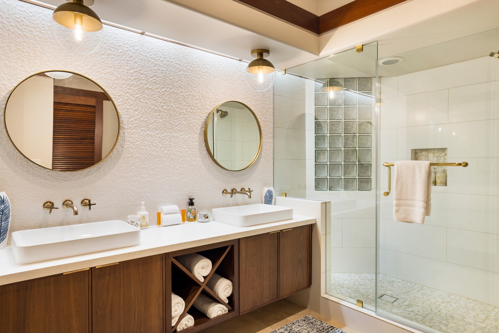 Kamuela Vacation Rentals, Champion Ridge 7 - Modern guest bathroom with double vanity, circular mirrors, and walk-in glass shower.