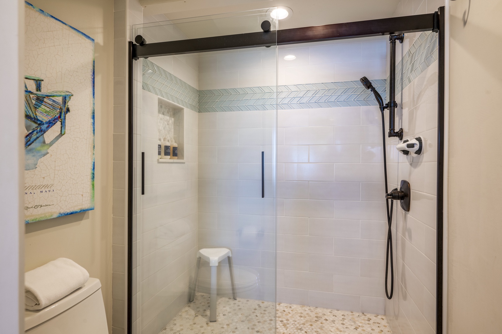 Lahaina Vacation Rentals, Puamana 240-3 - Refresh in a modern, spa-inspired primary bathroom with a sleek walk-in shower.