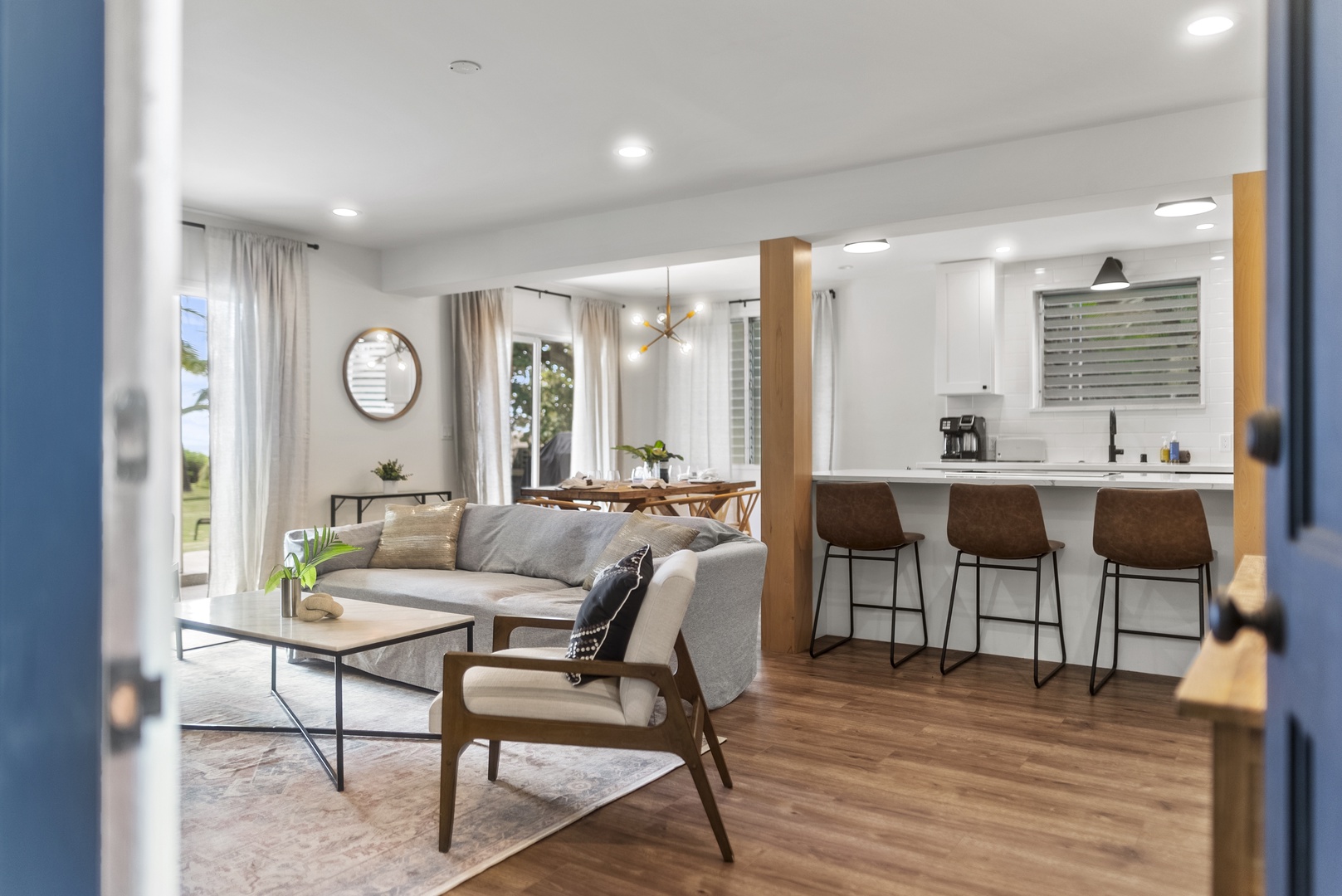 Honolulu Vacation Rentals, Honolulu Beachfront Retreat - Open-concept living space that seamlessly connects the indoors to the outdoors, perfect for entertaining or unwinding after a day of island adventures.
