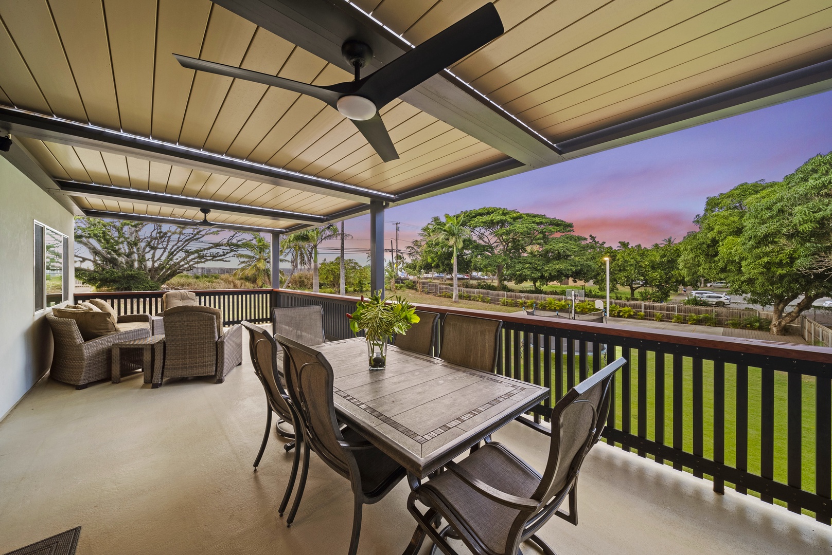 Haleiwa Vacation Rentals, Sunset Pickleball Paradise - Relax and dine in this covered outdoor area with ceiling fans, perfect for unwinding after a day of adventure.