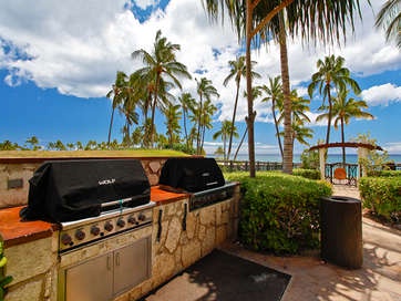 Kapolei Vacation Rentals, Ko Olina Beach Villas B701 - The BBQ grills surrounded by tropical palm trees and ocean air.