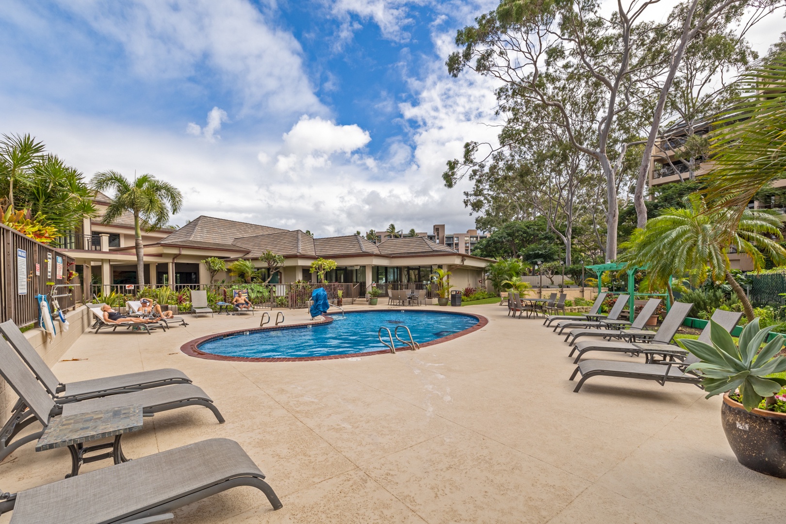 Lahaina Vacation Rentals, Valley Isle 804 - Relax by the inviting pool, surrounded by ample lounge chairs, perfect for soaking up the sun and enjoying a leisurely afternoon.