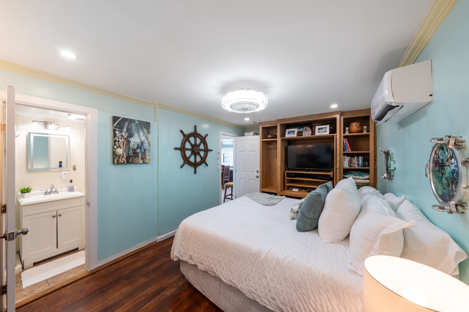 Hauula Vacation Rentals, Private Beach Paradise - A built-in media shelf faces the bed, with split A/C for warm afternoons.