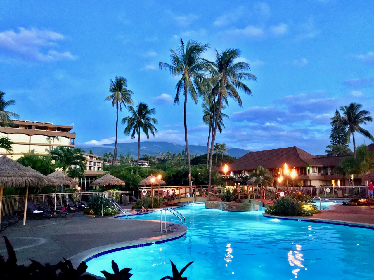 Lahaina Vacation Rentals, Maui Kaanapali Villas 292 - Enjoy an evening swim in the illuminated pool, with the tranquil backdrop of palm trees and the mountains.