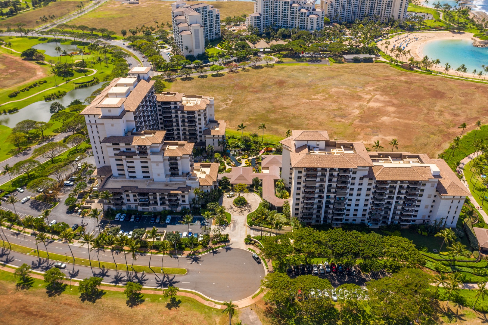 Pick out the pools and paths from up here, villas stepping down to the lagoon.