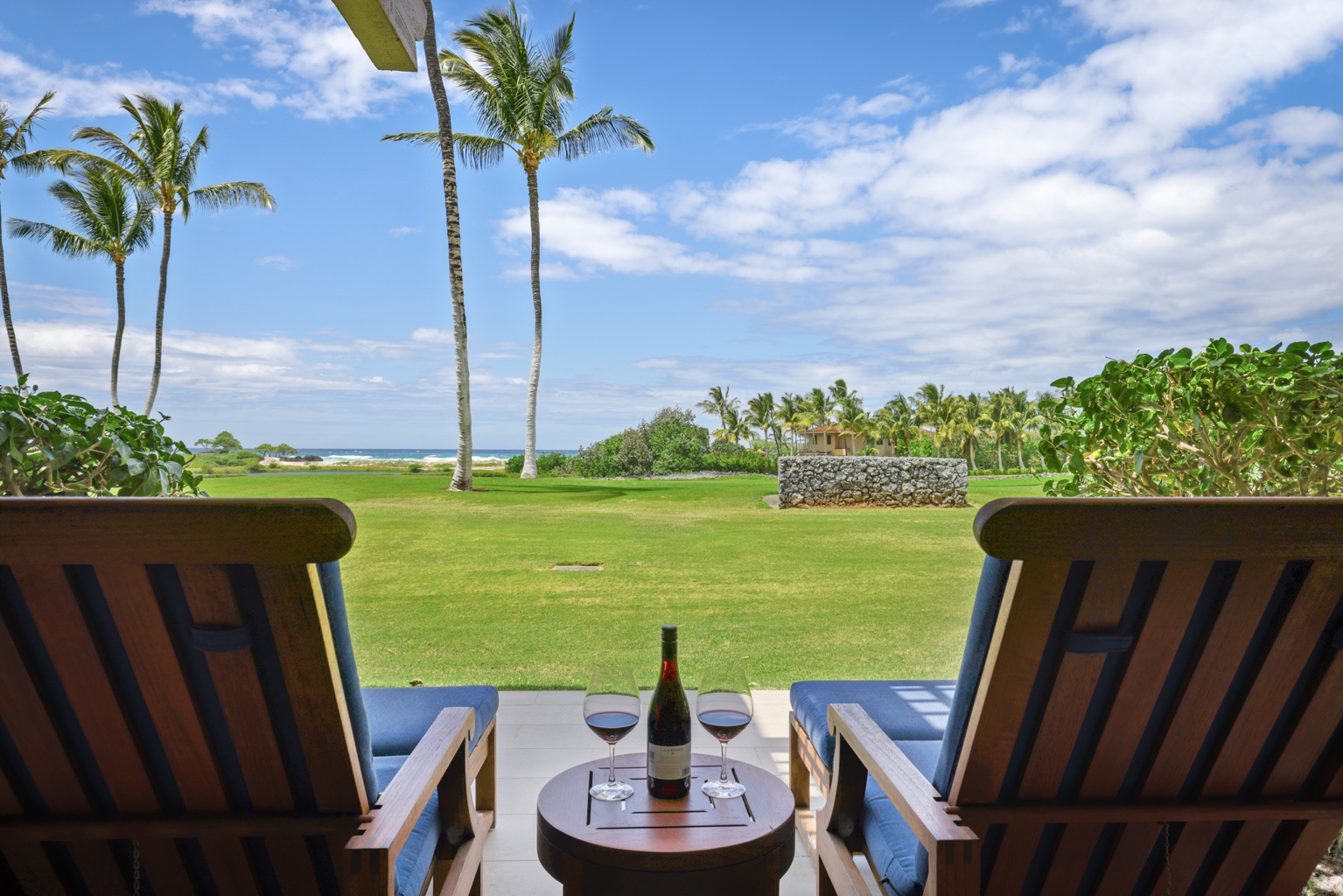 Kailua Kona Vacation Rentals, 3BD Golf Villa (3101) at Hualalai Resort - Closer view of lanai loungers with ocean views.