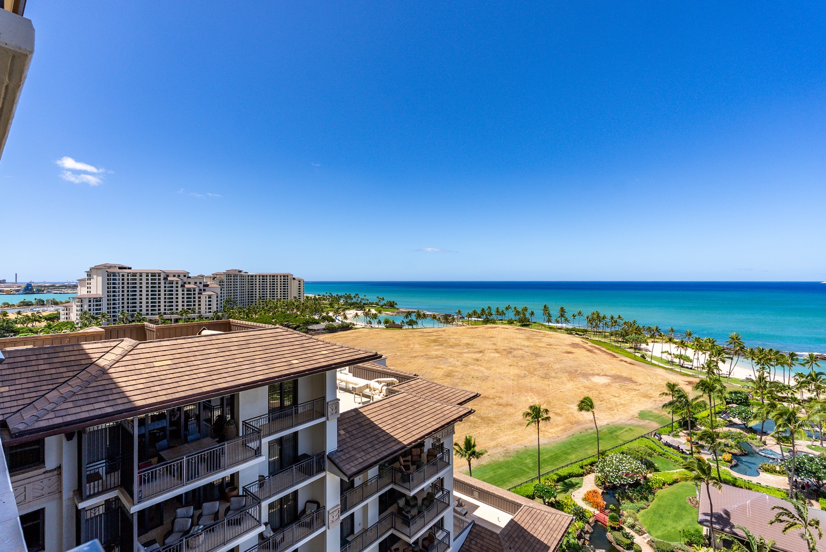 Kapolei Vacation Rentals, Ko Olina Beach Villas O1404 - Turquoise water meets the coastline as far as the windows reach.