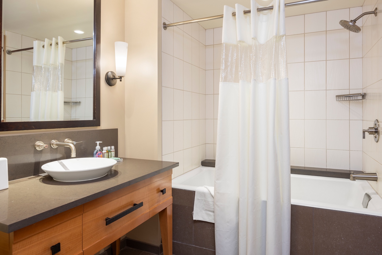 Kapolei Vacation Rentals, Ko Olina Beach Villas B609 - Unwind in your sleek bathroom with a rainfall shower and deep soaking tub, perfect for relaxing after exploring.