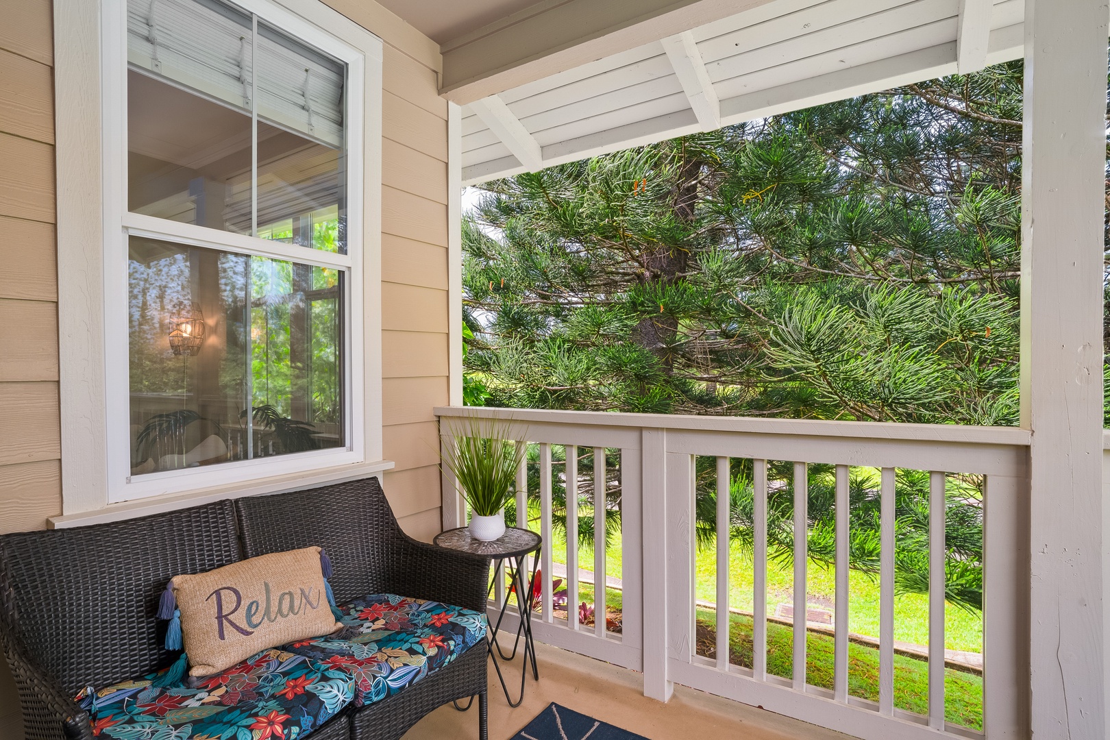 Princeville Vacation Rentals, Hale Kaua'i - Relax outdoors with peaceful garden views and a comfortable spot to enjoy the island breeze.