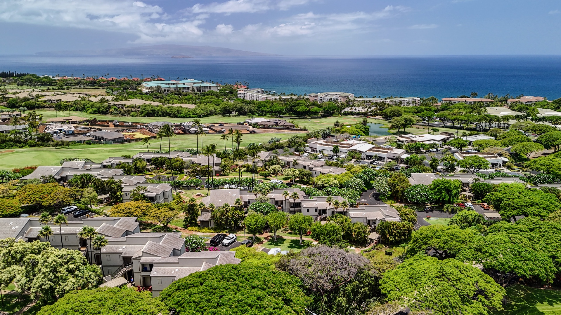 Kihei Vacation Rentals, Wailea Ekolu 204 - From up here, the neighboring islands sit hazy on the horizon on a clear day, resort rooftops marking where the golf course ends and the coast begins.