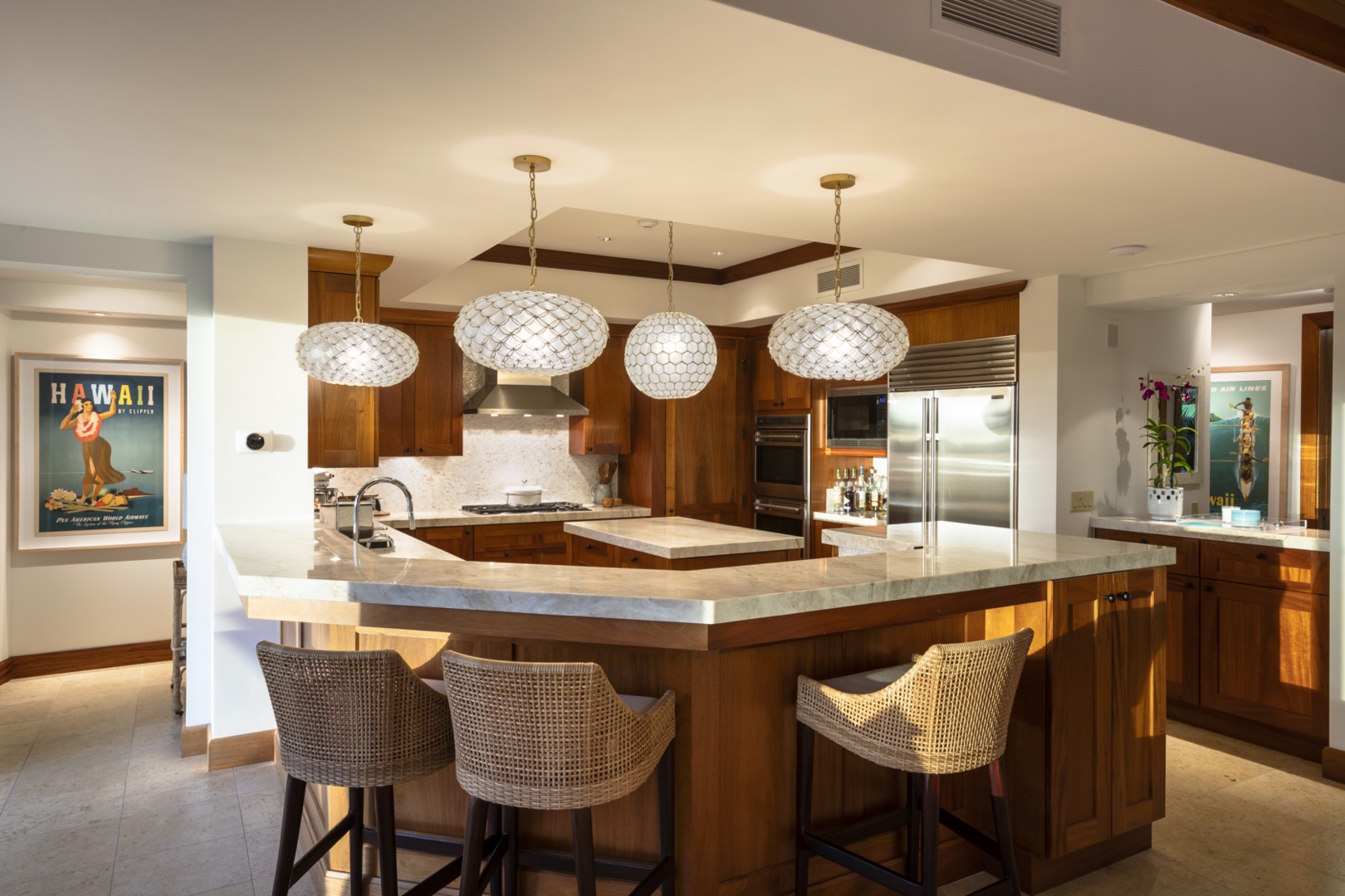 Kailua Kona Vacation Rentals, 4BD Kahikole Street Estate (218) at Hualalai Resort - Alternate view of the kitchen, fully equipped with top-tier appliances, ample prep space & bar seating