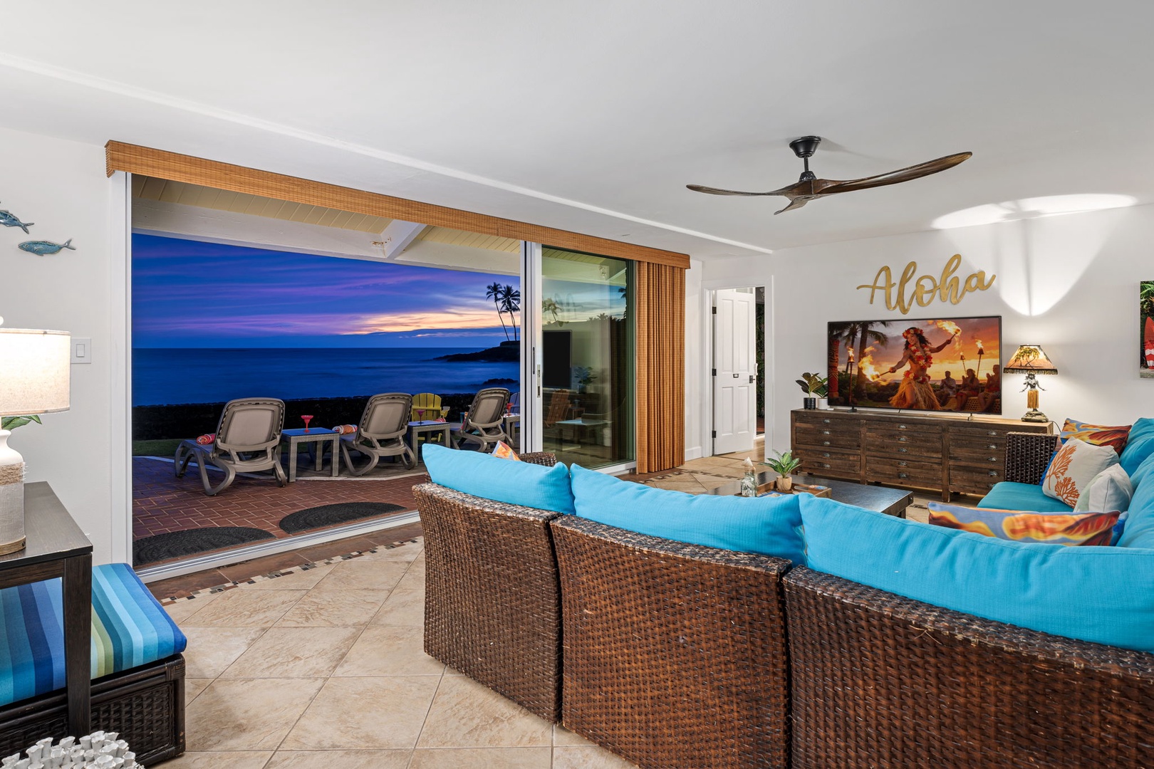 Kailua Kona Vacation Rentals, Hale Pua - Unwind in a breezy living space, where open doors frame the ocean beyond.