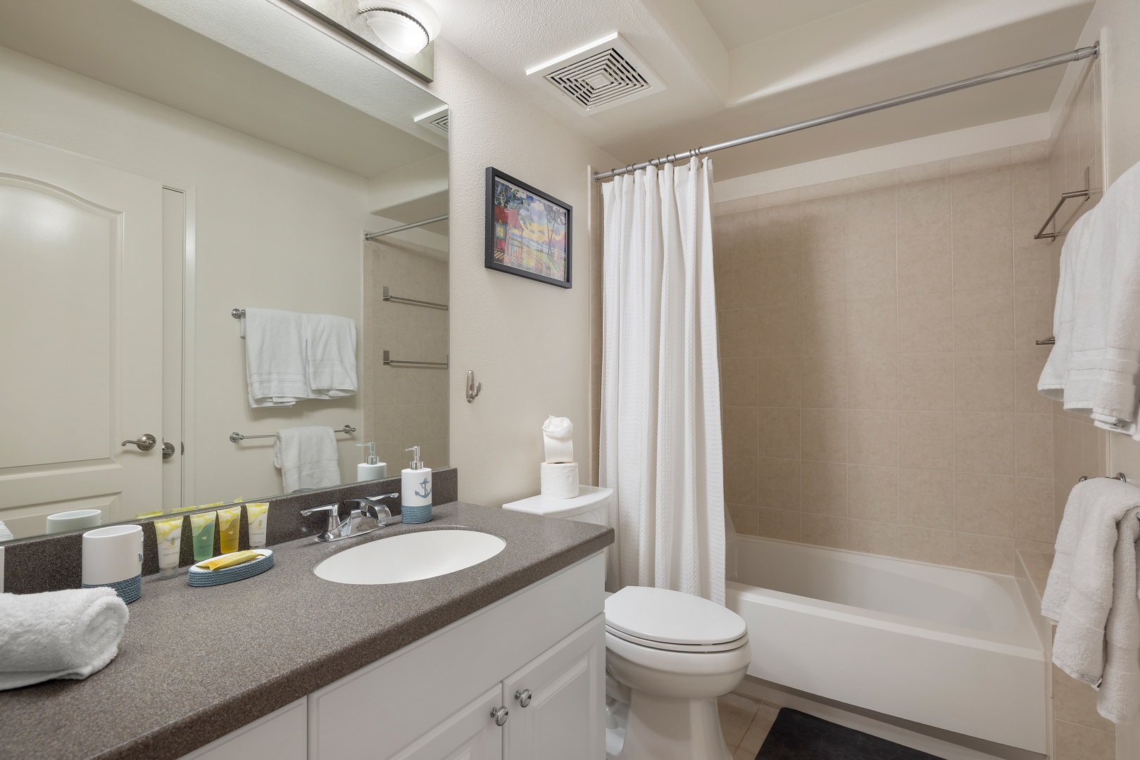 Kapolei Vacation Rentals, Ko Olina Kai 1061F - Refresh in your private bathroom with a full tub-shower combo, granite counters, and fluffy towels waiting for your arrival.