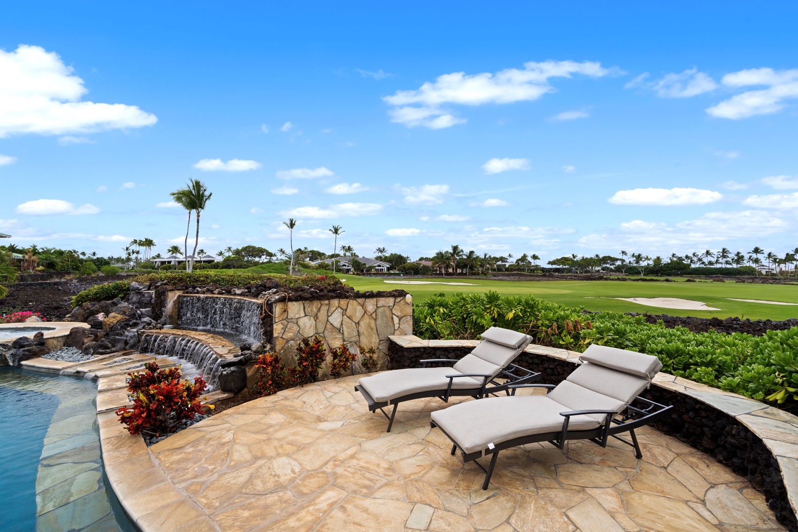 Kamuela Vacation Rentals, Hale Konane - Sunbathe poolside with plush loungers, surrounded by lush greens and peaceful vibes.
