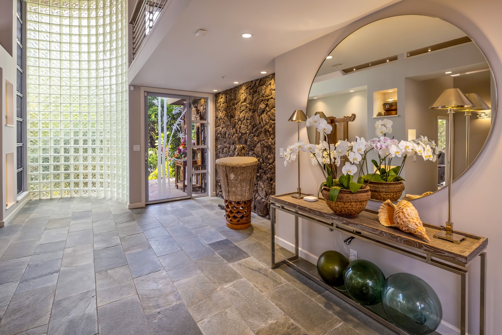 Honolulu Vacation Rentals, Manoa Royal Retreat - Grand entry hall with custom finishes and warm, welcoming design elements.