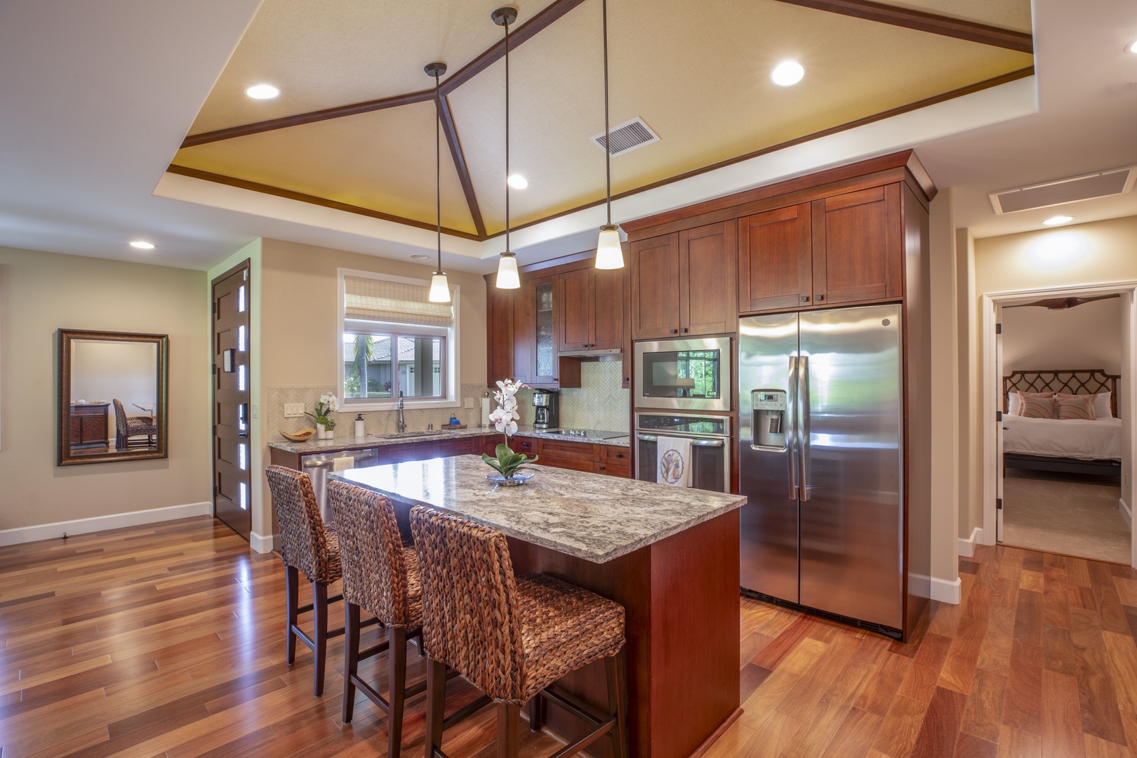 Kamuela Vacation Rentals, Mauna Lani KaMilo #503 - Cook like a pro in the chef-inspired kitchen with stainless steel appliances, granite countertops, and a spacious island.