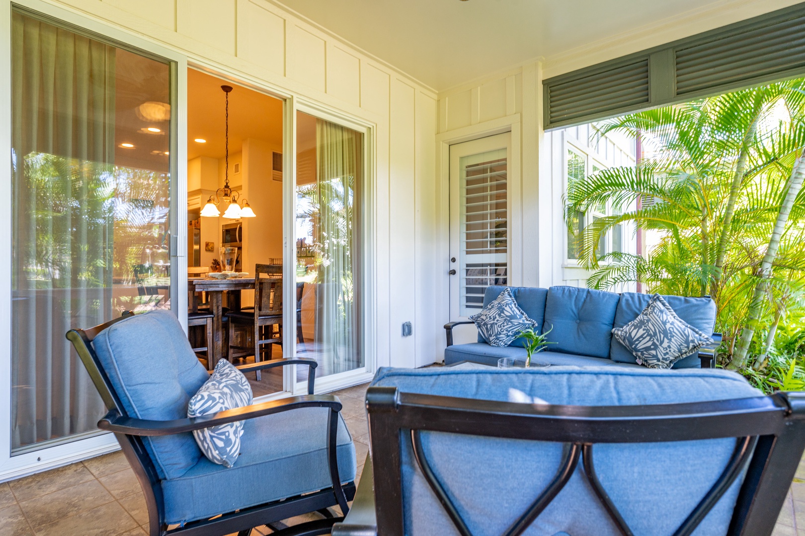 Kapolei Vacation Rentals, Coconut Plantation 1208-2 - Take in the island breezes and lush greenery on the lanai.