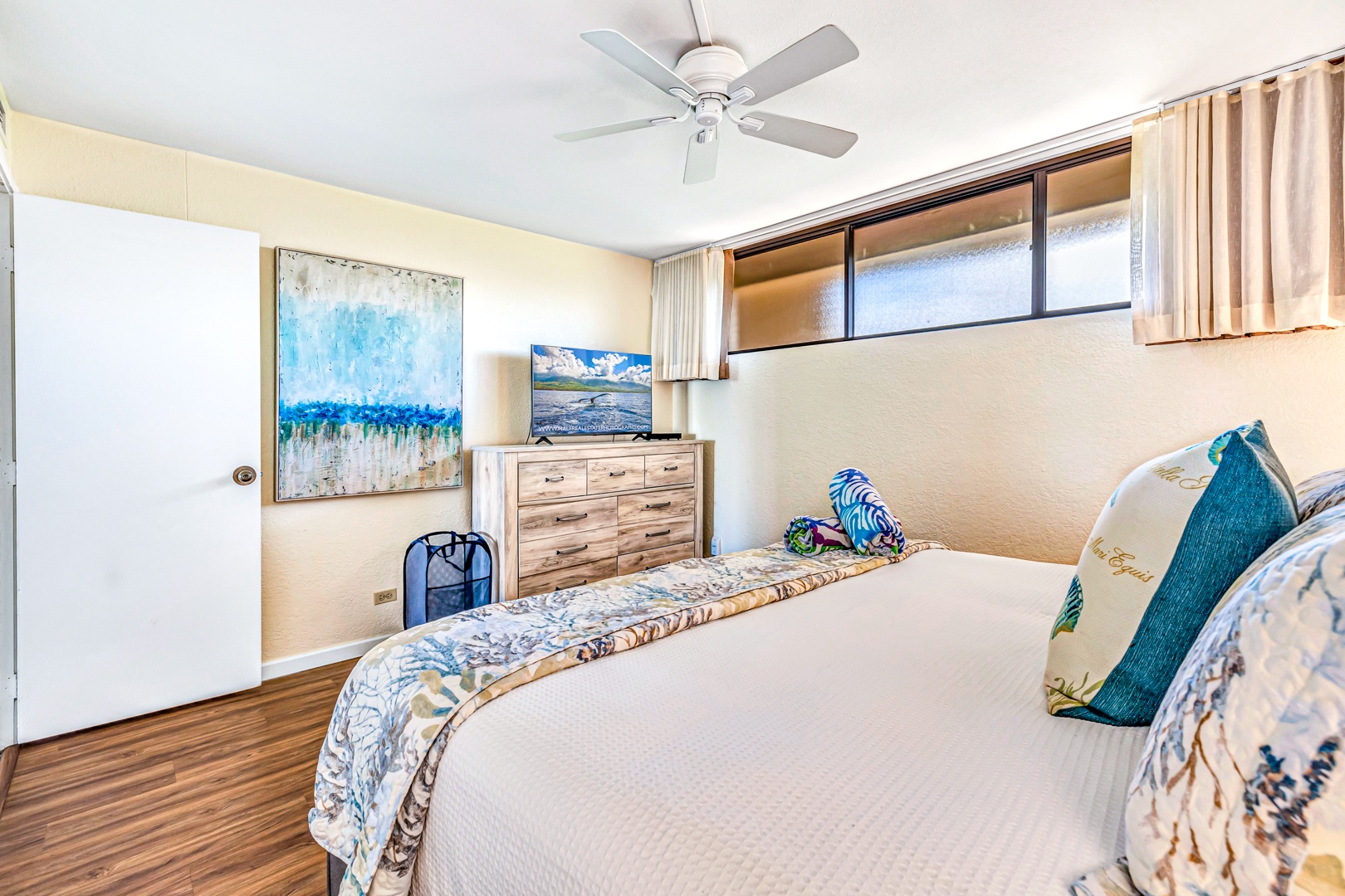 Lahaina Vacation Rentals, Kaanapali Shores 746 - The cozy bedroom offers a king-sized bed, flat-screen TV, and tasteful artwork, making it a relaxing space to unwind.