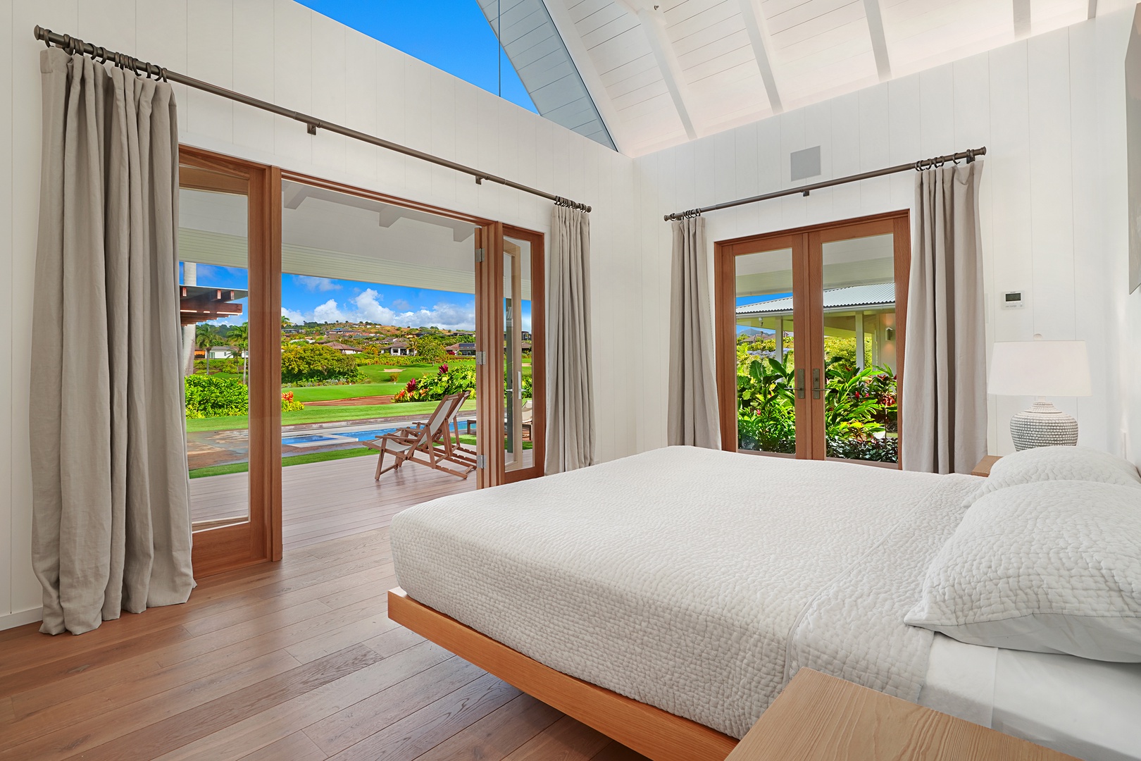 Koloa Vacation Rentals, Kaulu Hale at Kukuiula - Bright, airy bedroom with garden views and seamless outdoor access.