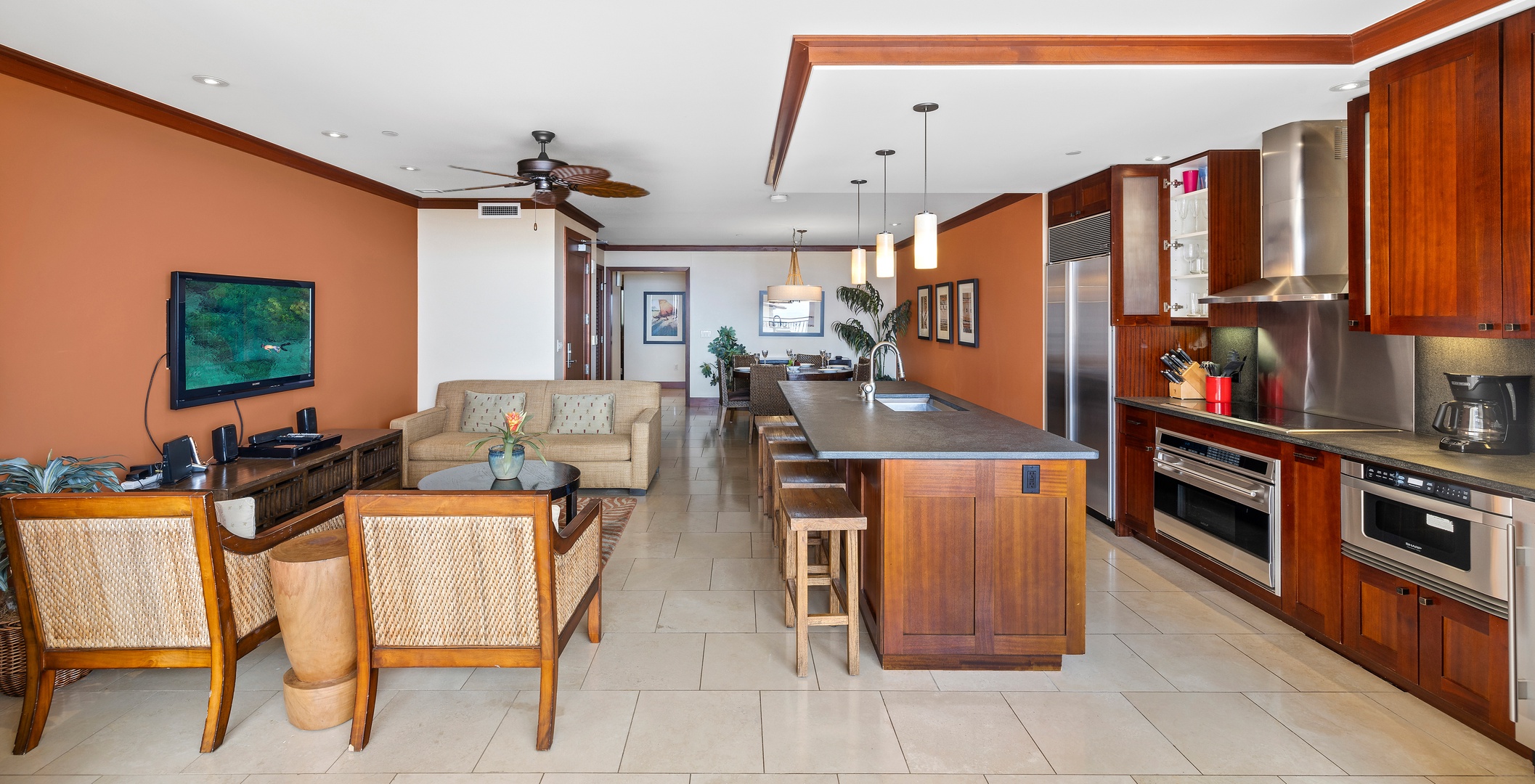 Kapolei Vacation Rentals, Ko Olina Beach Villas O1001 - A well designed living area with warm wood accents.